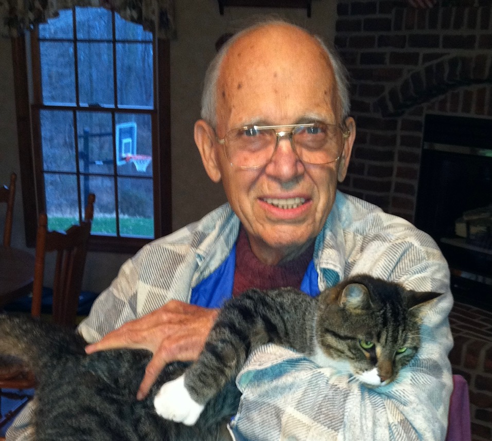 Image of Bernie with a cat.